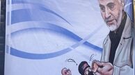  قاسم سلیمانی در حال پیچاندن گوش یک داعشی /عکس