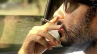 سیگار کشیدن نوید محمدزاده در ماشین + عکس