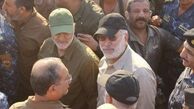 رونمایی از پوستر شهیدان سلیمانی و المهندس در عراق+ فیلم
